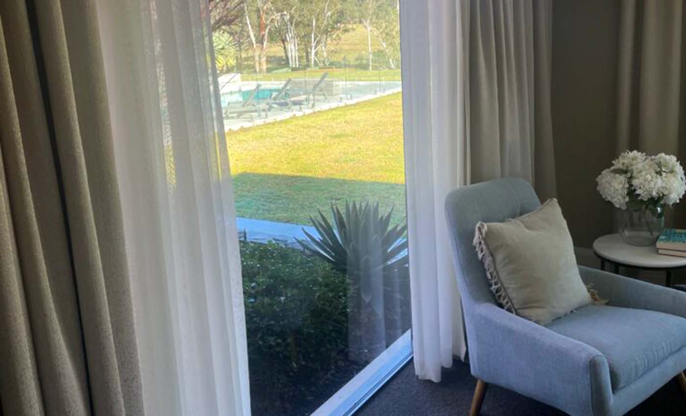 Layered sheer and blockout curtains