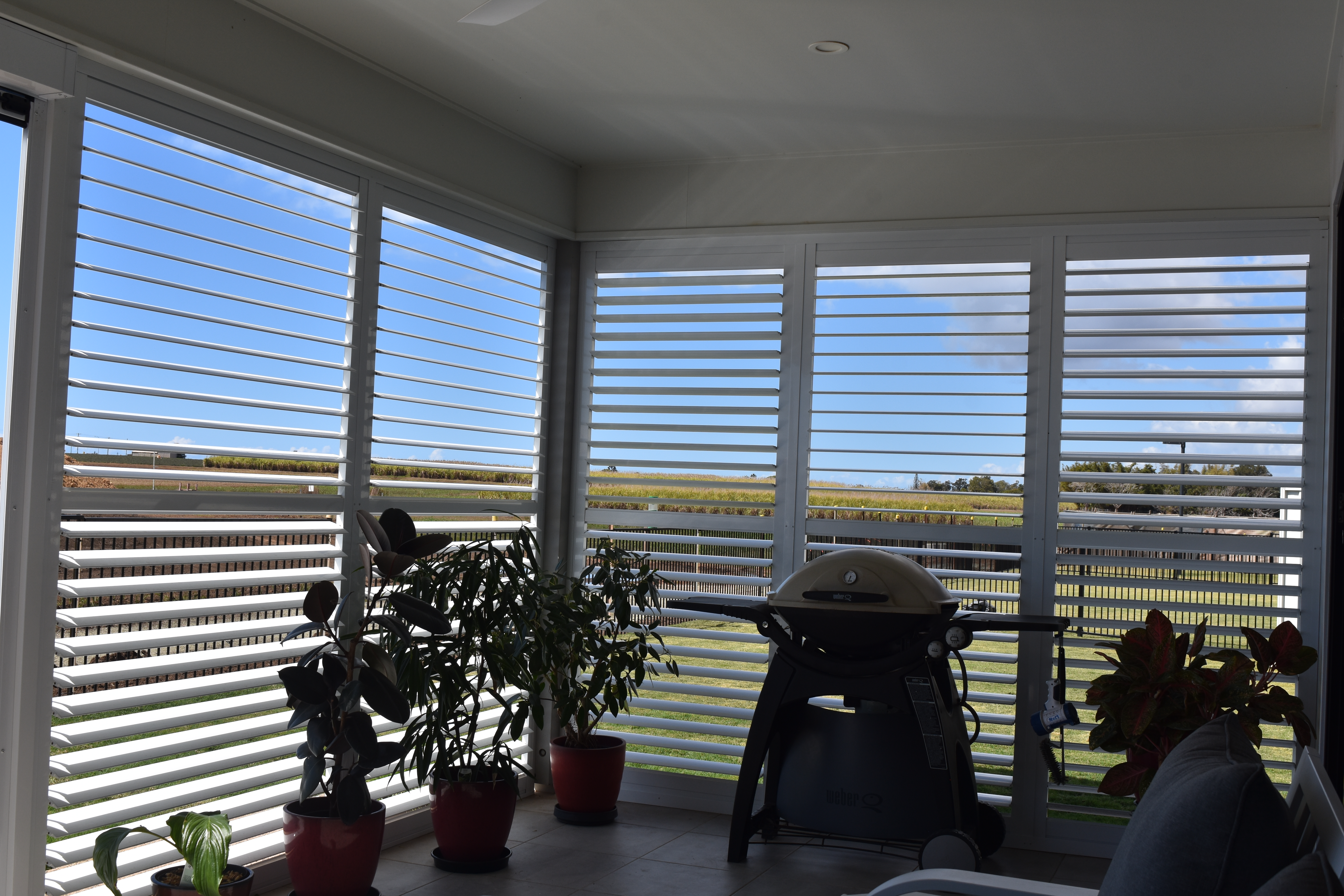 Plantation shutters fitted to a bay window